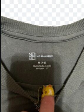 Woman's green short sleeve top with mushrooms